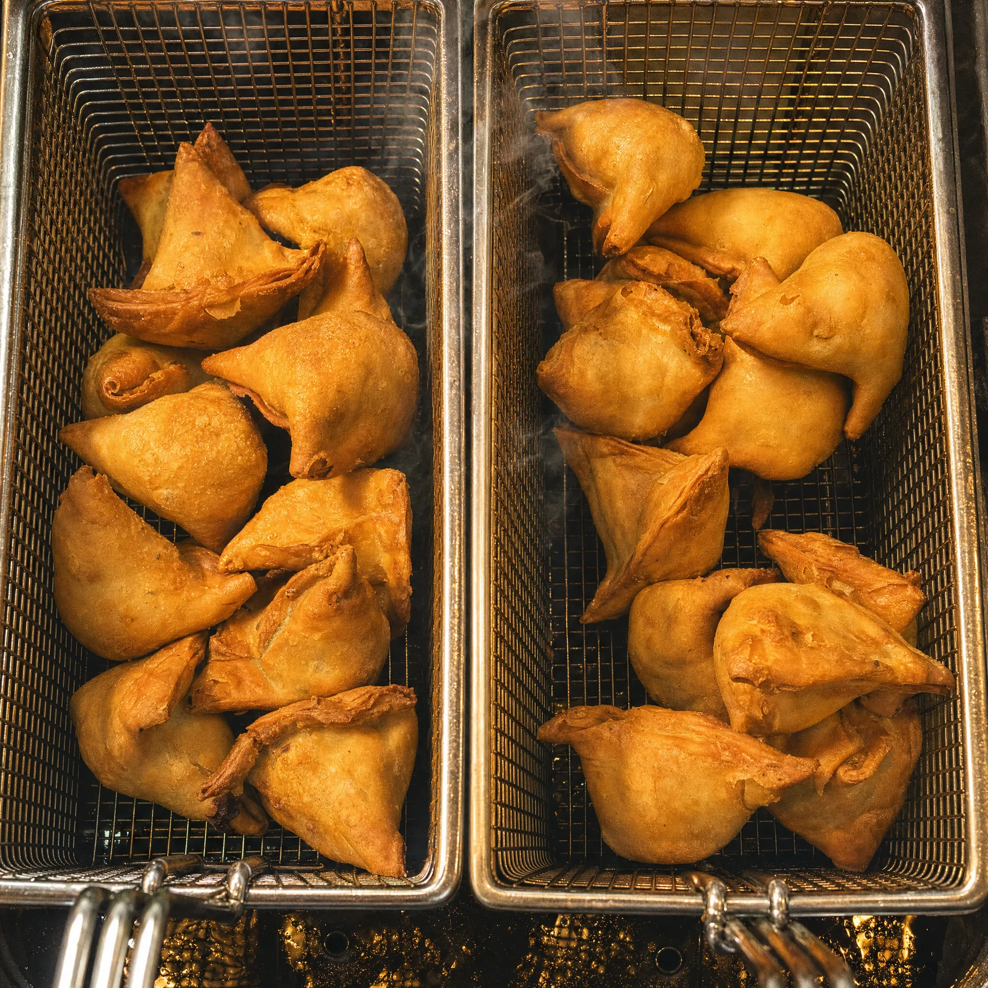 Fresh samosas frying